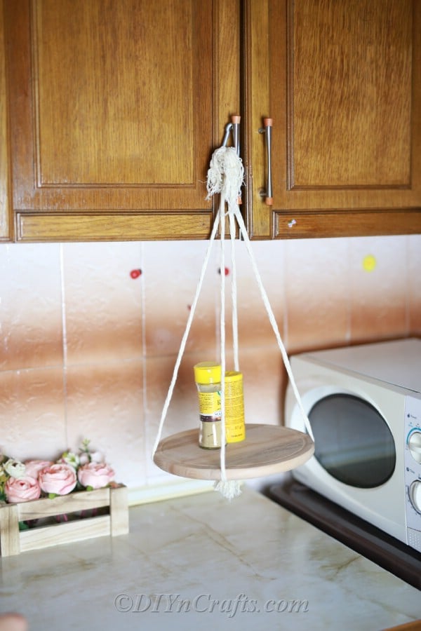 A hanging shelf in a kitchen.