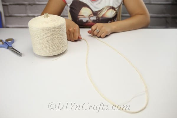 Gather all the lengths of string you will need for the project.