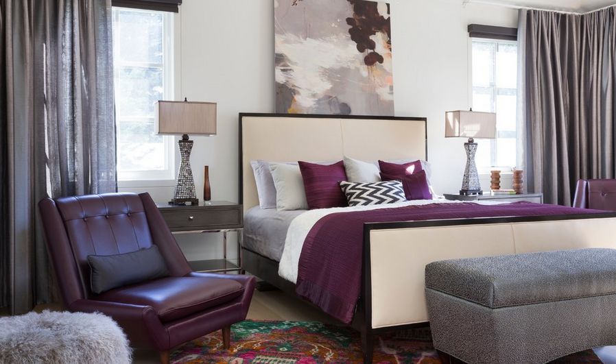 Accent colors bedroom with bed placed between windows