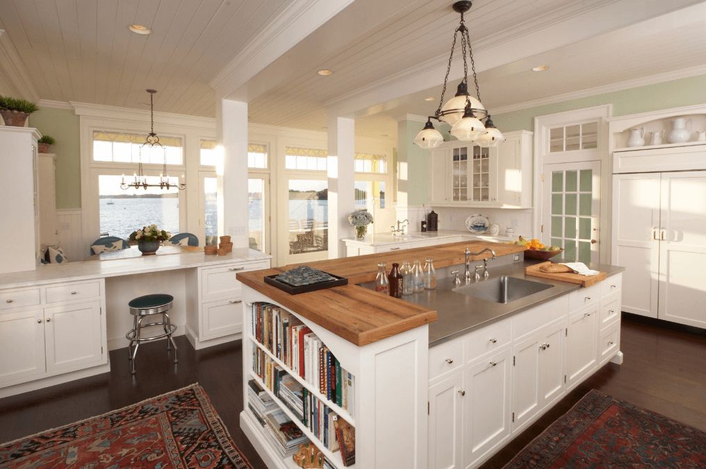 White kitchen island with a butcher counter top