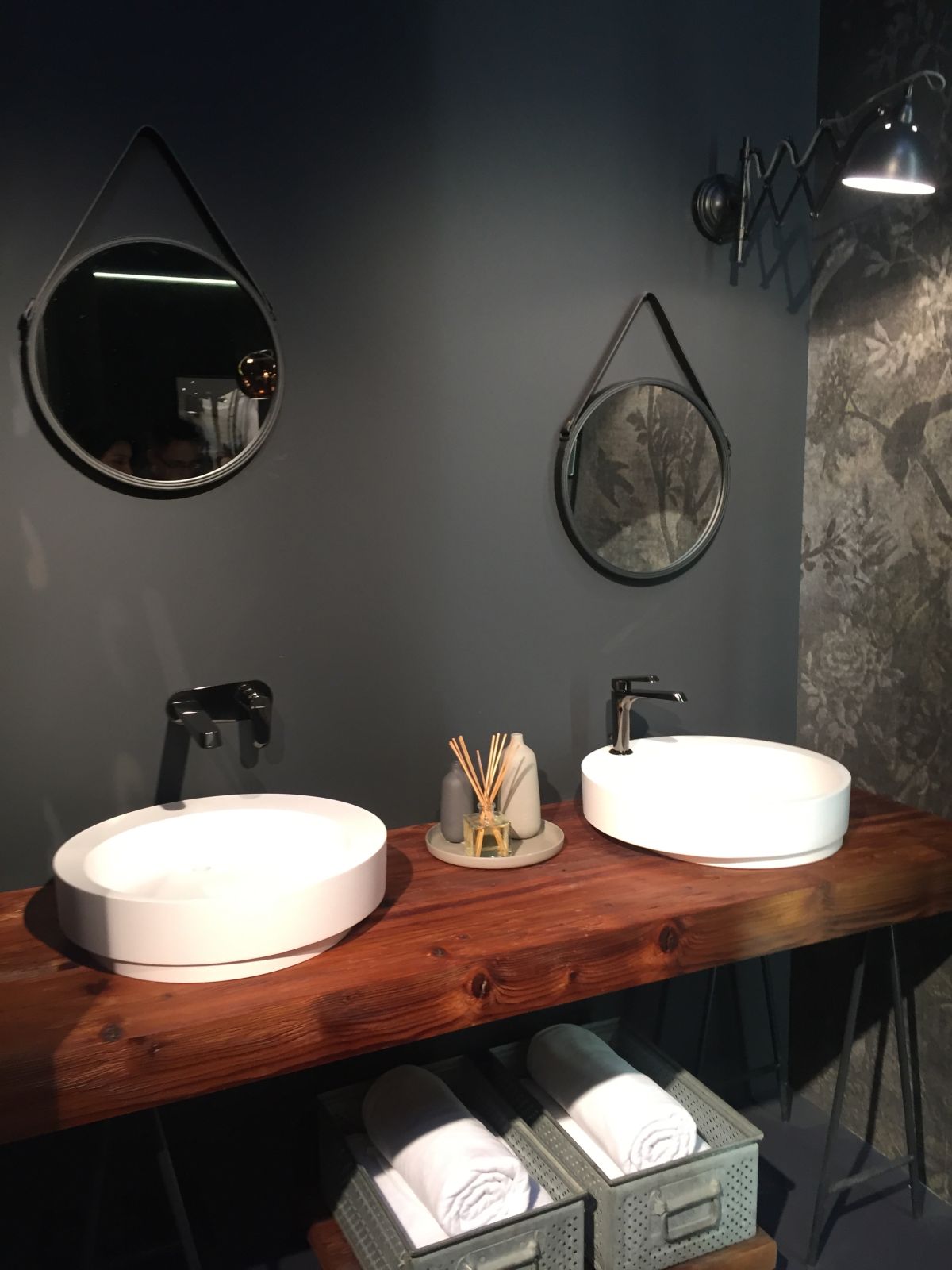 wood countertop that holds two bathroom sinks