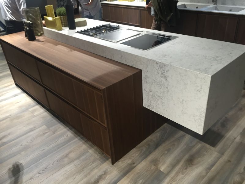 Floating marble island mixed with a lower countertop