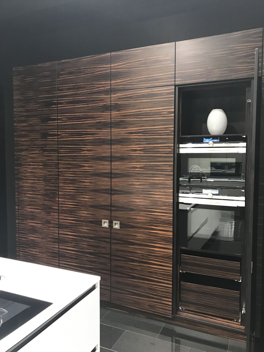 The doors at the ends open separately and in this case are big enough to conceal appliances such as the oven