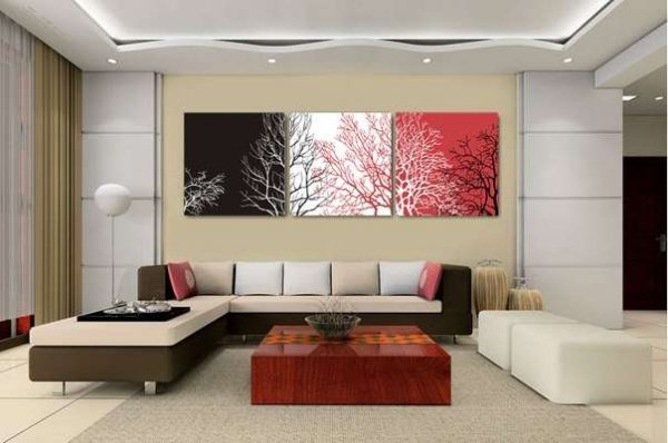 модульная картина с абстракцией разных цветов в интерьере гостиной над диваном