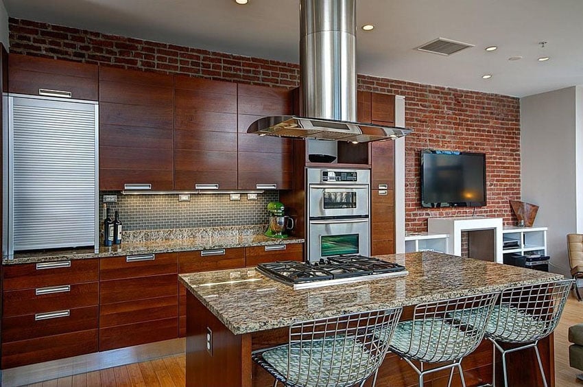 Contemporary kitchen with brick wall granite dining island with built in stove