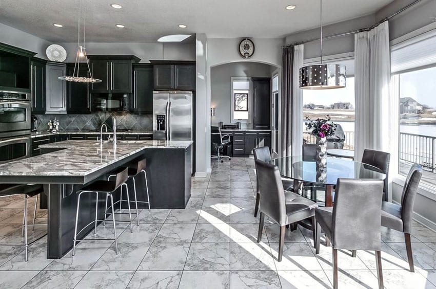 Black cabinet kitchen with open concept to dining area