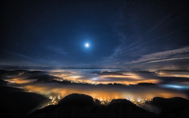 Starry night over the clouds