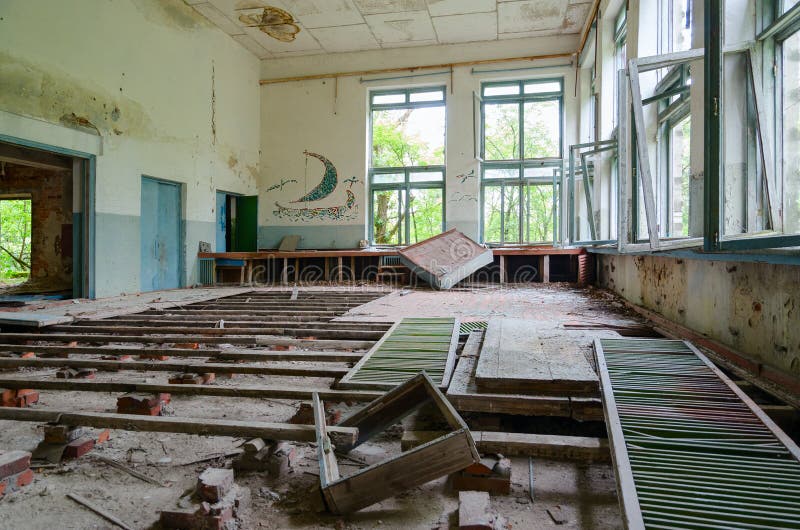 Abandoned building of former House of Culture in resettled village of Pogonnoye in exclusion zone of Chernobyl nuclear power plant stock photography