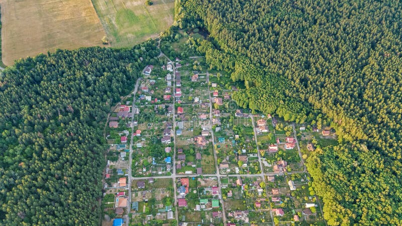 Aerial top view of residential area summer houses in forest from above, countryside real estate and dacha village in Ukraine. Aerial top view of residential area stock photography