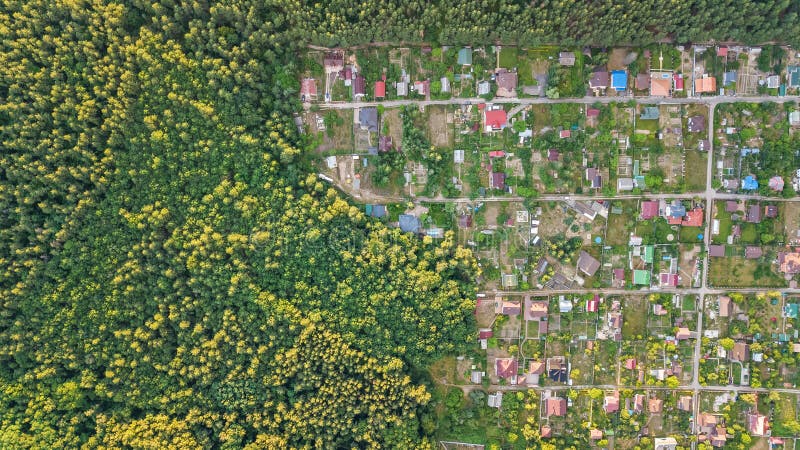 Aerial top view of residential area summer houses in forest from above, countryside real estate and dacha village in Ukraine. Aerial top view of residential area royalty free stock photos