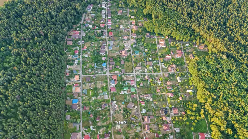 Aerial top view of residential area summer houses in forest from above, countryside real estate and dacha village in Ukraine. Aerial top view of residential area royalty free stock images