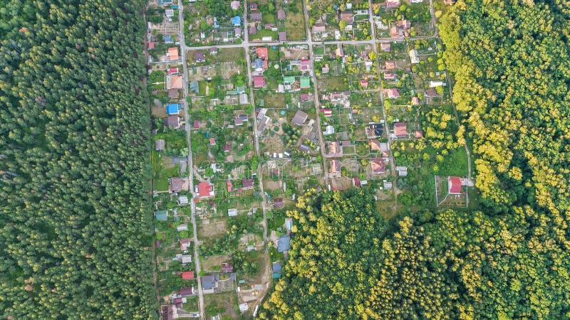 Aerial top view of residential area summer houses in forest from above, countryside real estate and dacha village in Ukraine. Aerial top view of residential area royalty free stock photo