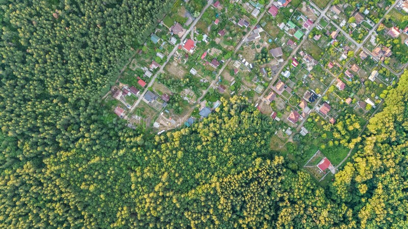 Aerial top view of residential area summer houses in forest from above, countryside real estate and dacha village in Ukraine. Aerial top view of residential area royalty free stock photo