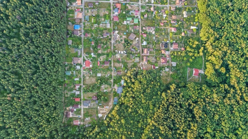 Aerial top view of residential area summer houses in forest from above, countryside real estate and dacha village in Ukraine. Aerial top view of residential area stock photos