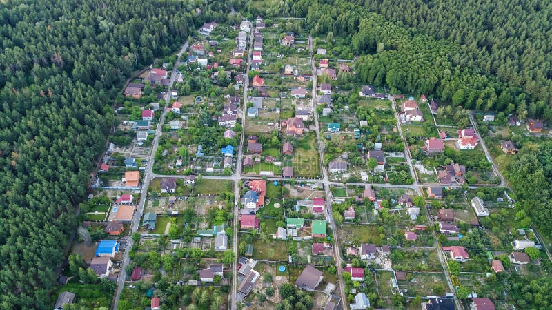 Aerial top view of residential area summer houses in forest from above, countryside real estate and dacha village in Ukraine. Aerial top view of residential area stock image