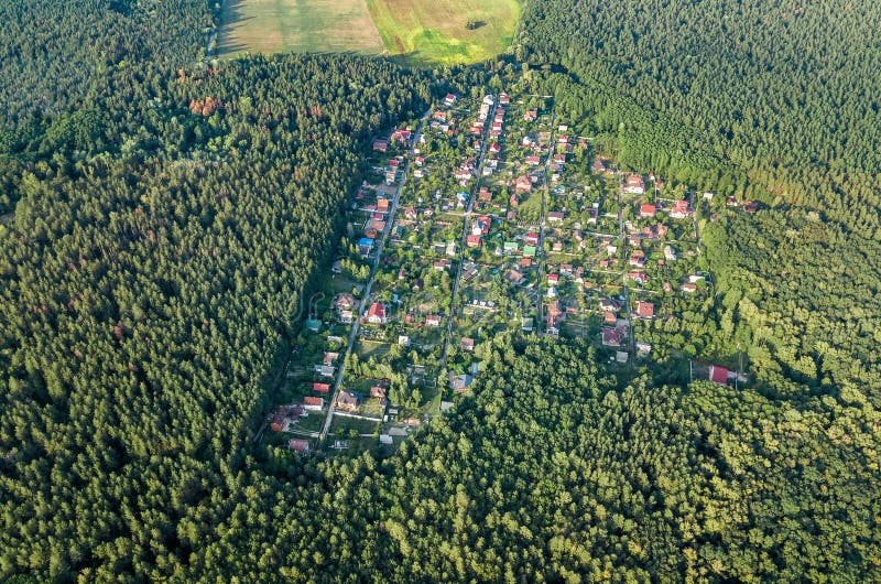Aerial top view of residential area summer houses in forest from above, countryside real estate and dacha village in Ukraine. Aerial top view of residential area stock photography