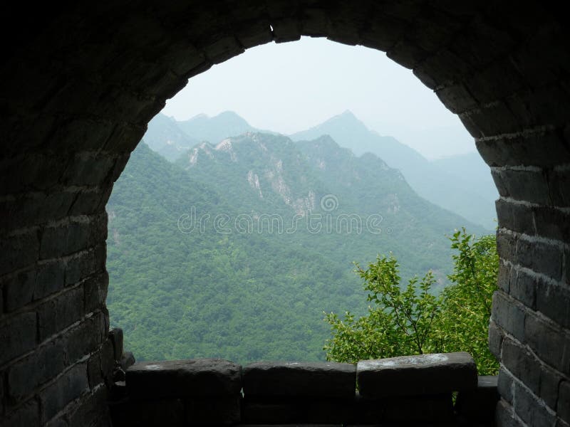 Amazing shot of an old brick arch balcony with a mountain landscape view. An amazing shot of an old brick arch balcony with a mountain landscape view royalty free stock images