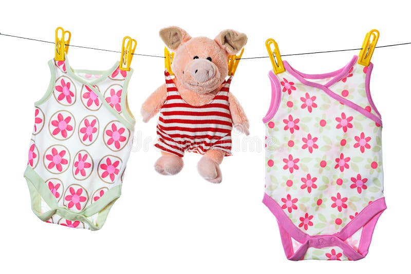 Baby sleepers and pig on the clothesline stock photos