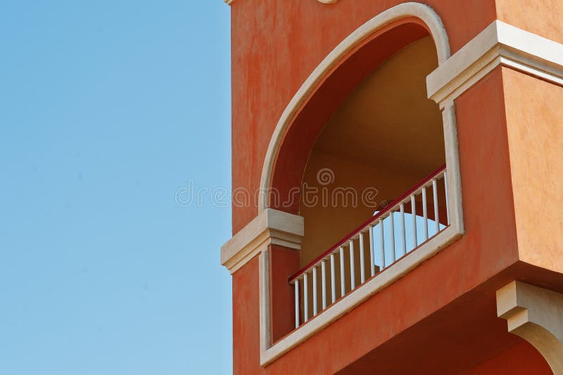 Balcony arch of arabic orange house background blue sky.  stock images