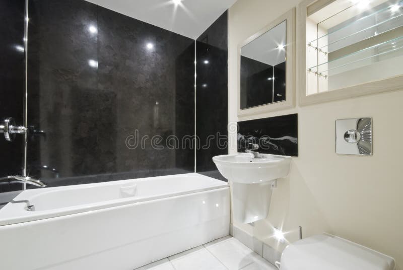 Bathroom with black stone tiles stock photography