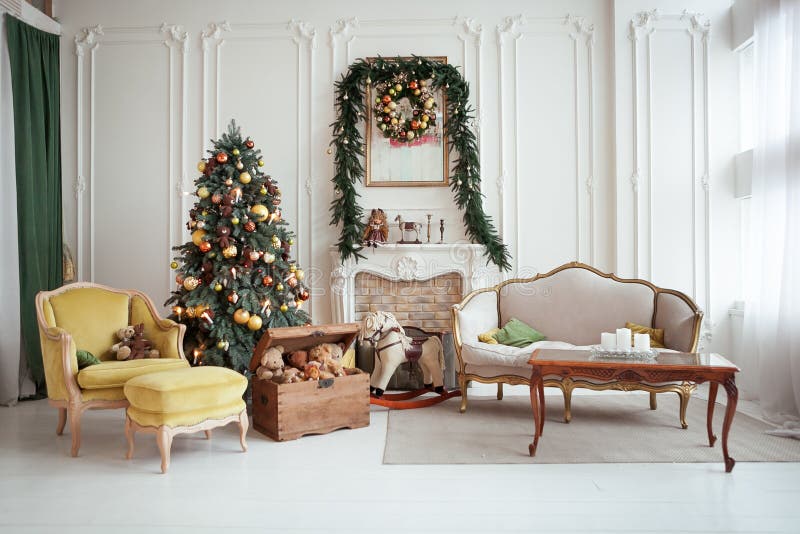 Beautiful Christmas interior. New year decoration. Living room with fireplace. Beautiful Christmas interior. Isolated wreath on wall. New year decoration. Living royalty free stock photos