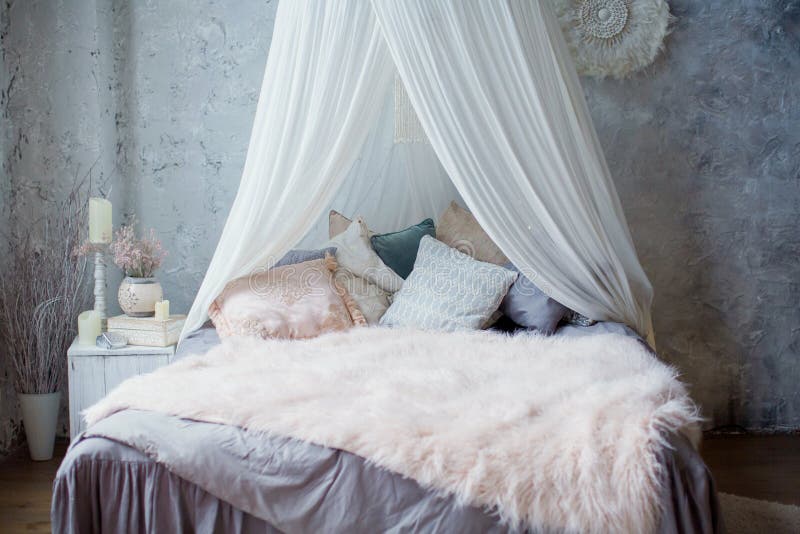 Cozy bedroom with canopy stock photo