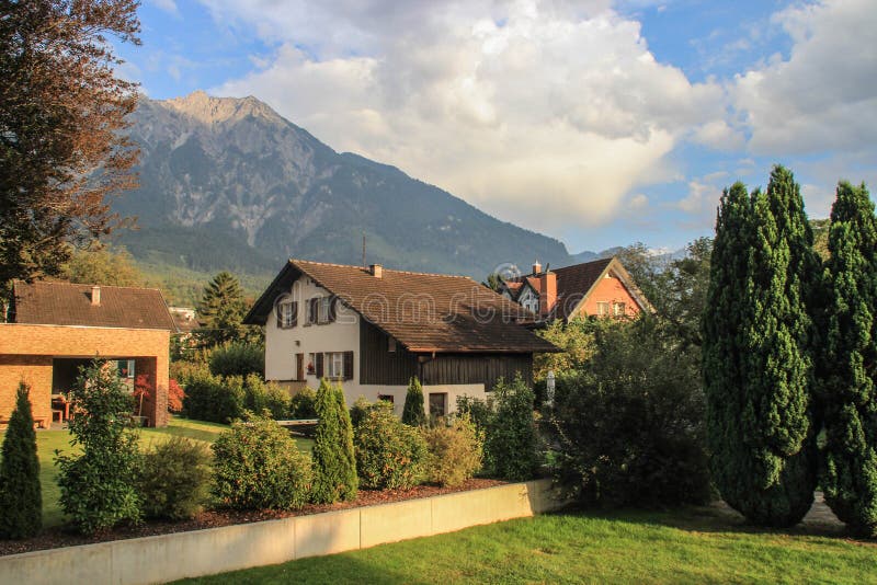 Beautiful cozy European houses surrounded by a garden. In Liechtenstein royalty free stock photo