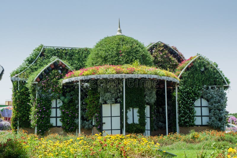 Beautiful mansion decorated with different flowers. Beautiful mansion covered with different flowers royalty free stock images Beautiful mansion decorated with different flowers. Beautiful mansion covered with different flowers royalty free stock images