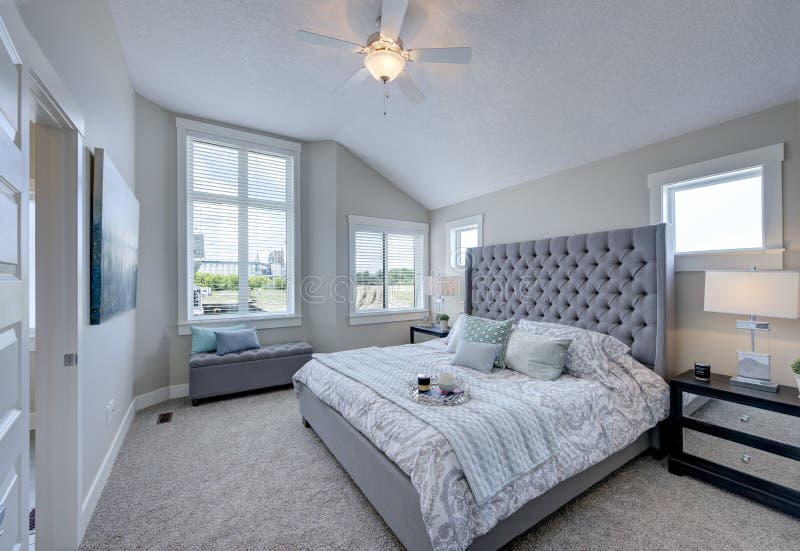 Large Master Bedroom Featuring Plenty of Light. stock photo