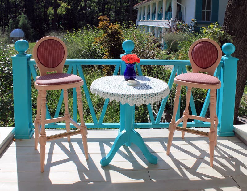 Beautiful terrace with bright colored furniture in country resta. Urant stock photo
