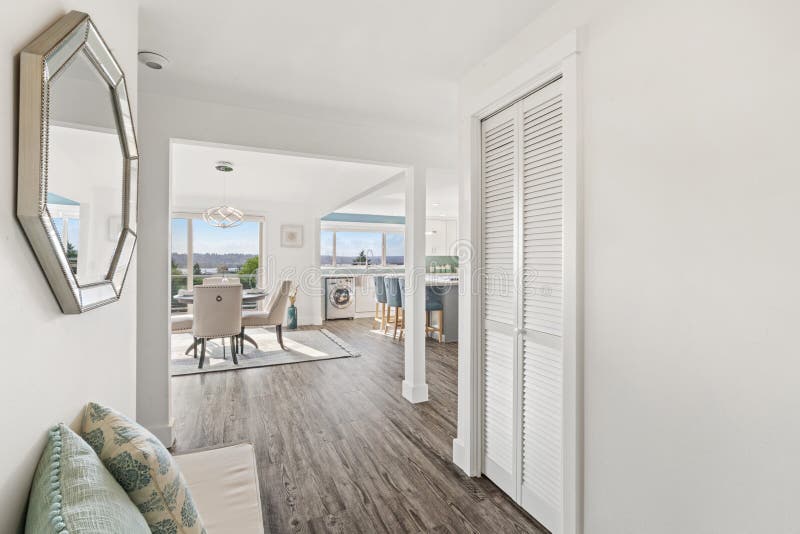 Beautiful white hallway interior with grey hardwood floors stock images