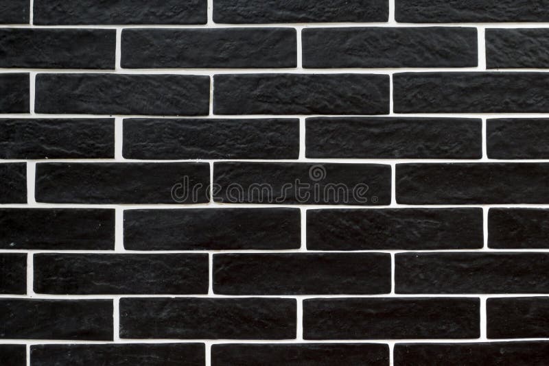 Black brick tiles with white grouting stock images