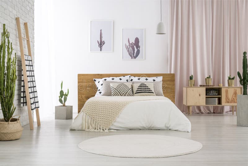 Bright bedroom with cactus motif royalty free stock photos