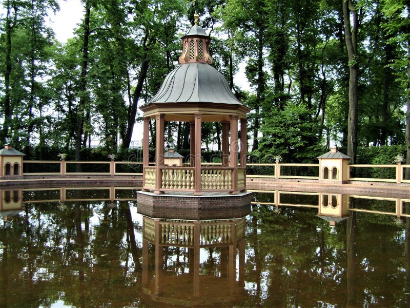 Bright summer landscape with pond and gazebo in chinese garden, Saint-Petersburg royalty free stock photos