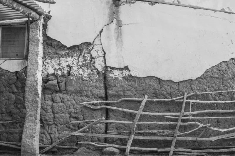 A broken incomplete abandoned building house, rural Indian village mud house black and white stock photos