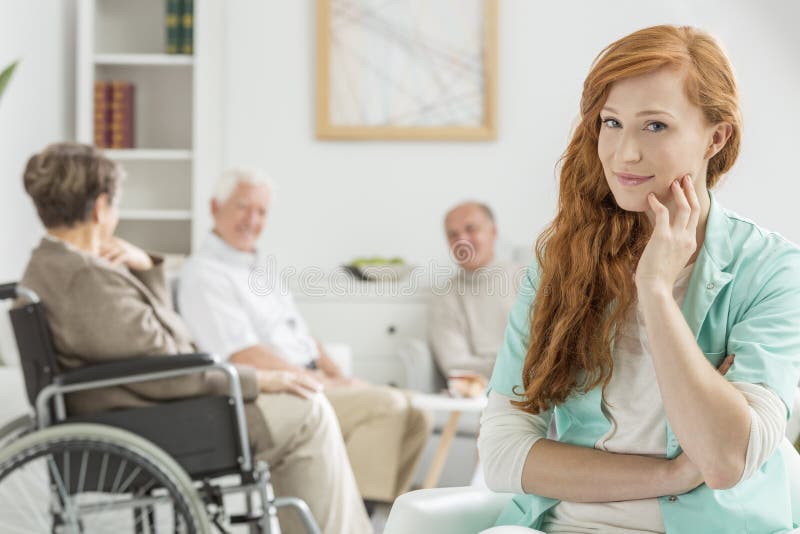 Carer in nursing home stock image