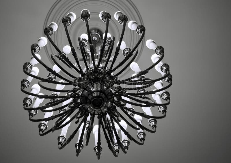 Chandelier. Hanging on ceiling, retro style in black and white stock photography