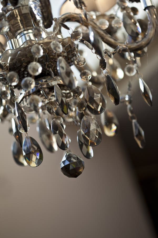 Chandelier. Details of a glass chandelier inside a house stock image