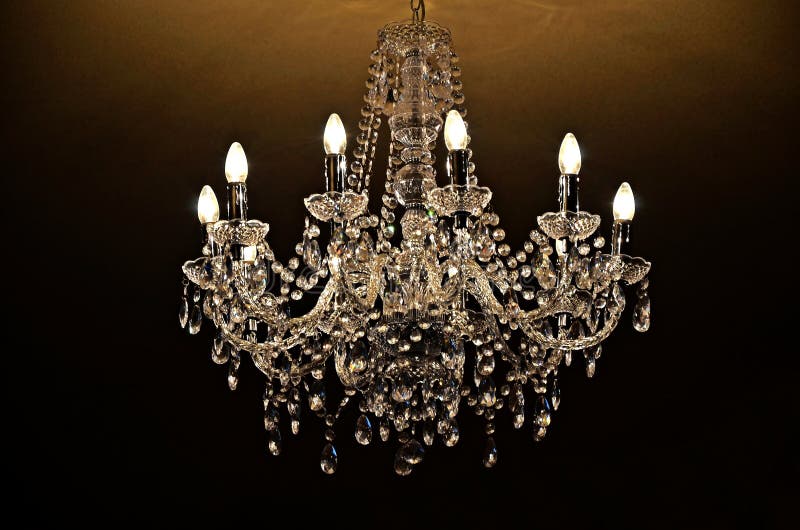 Chandelier of crystal. On dark background royalty free stock photo