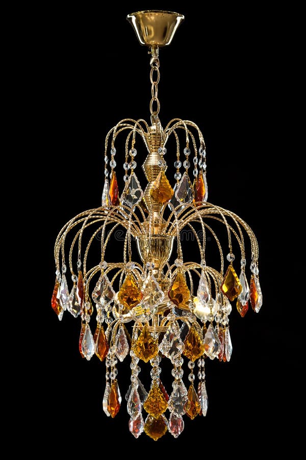 Chandelier for interior of the living room. chandelier decorated with crystals and amber isolated on black background. Classic Chandelier for interior stock photography