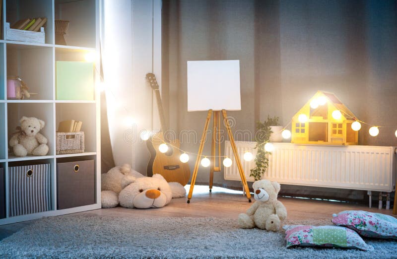 Children`s room with evening illumination. Cozy children`s room interior with evening illumination stock images
