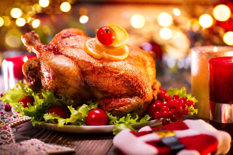 Christmas family dinner. Christmas holiday decorated table with turkey stock photo