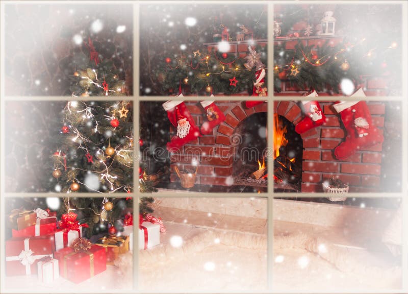 Christmas fireplace in the room. Christmas decorated fireplace and tree in the room - view throw the window, outdoor stock photo