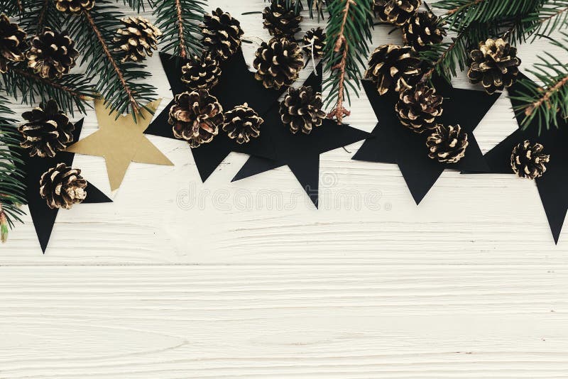 christmas flat lay. modern christmas layout with green fir branches, golden pine cones and stars, top view with space for text. h stock photography christmas flat lay. modern christmas layout with green fir branches, golden pine cones and stars, top view with space for text. h stock photography