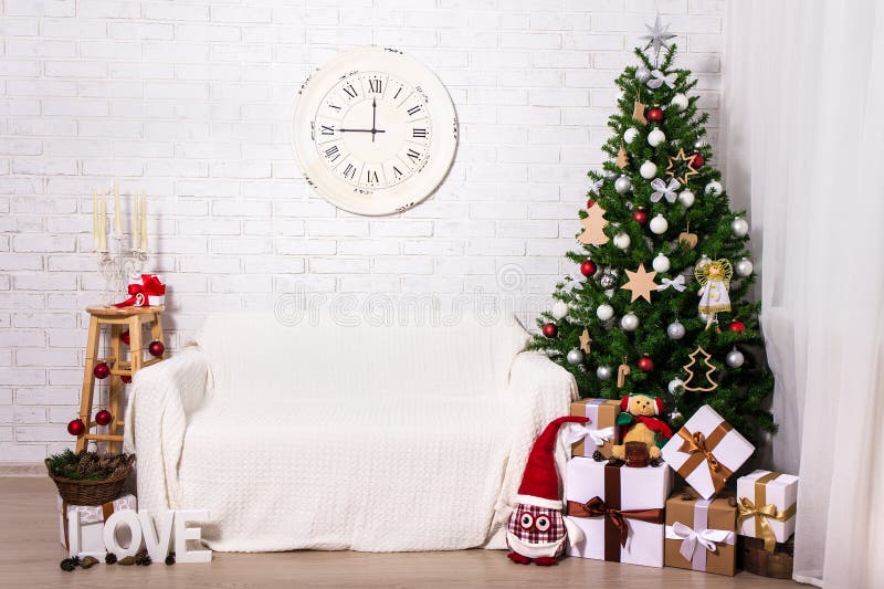 Christmas interior -christmas tree, gift boxes and decorations i royalty free stock photo