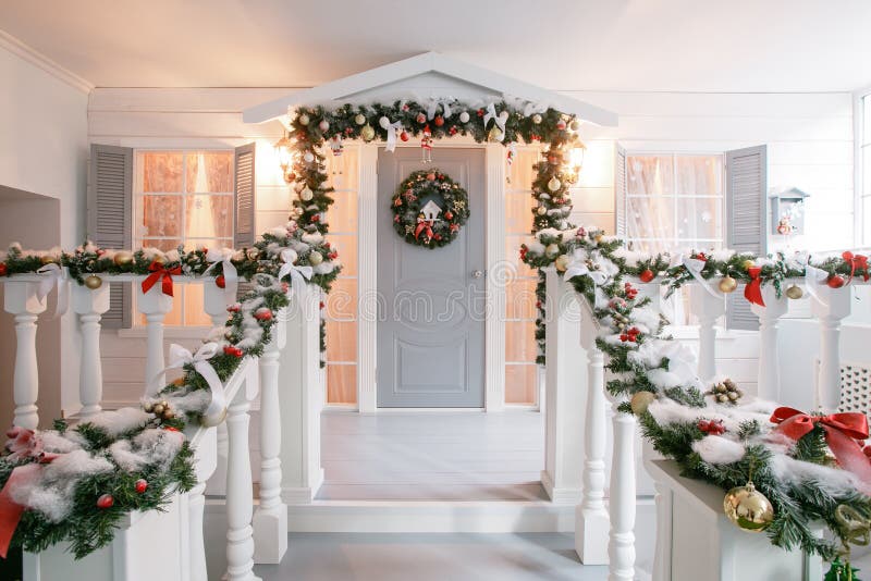 Christmas morning. classic luxury apartments with a white fireplace, decorated tree, bright sofa, large windows. Christmas morning. classic apartments with a royalty free stock image