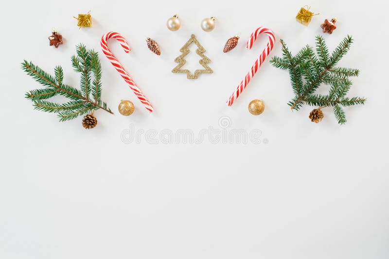 Christmas and new year composition. Christmas gift, knitted blanket, cones, fir branches, candy cane on white wooden background. F royalty free stock images Christmas and new year composition. Christmas gift, knitted blanket, cones, fir branches, candy cane on white wooden background. F royalty free stock images