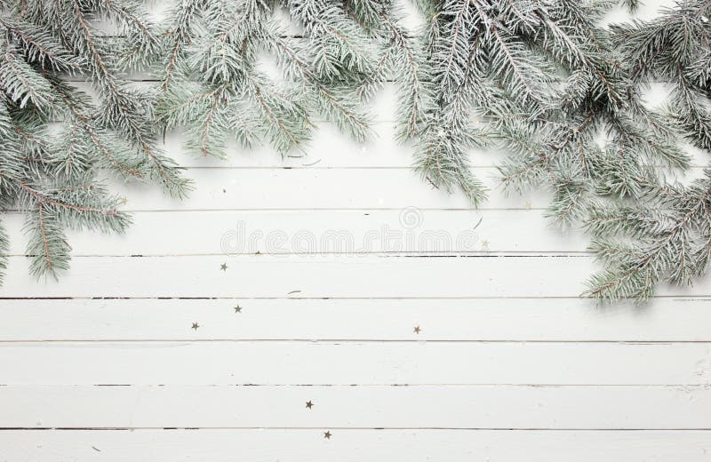 Christmas and New Year decoration composition. Top view of fur-tree branches on wooden background with place for your royalty free stock photo Christmas and New Year decoration composition. Top view of fur-tree branches on wooden background with place for your royalty free stock photo