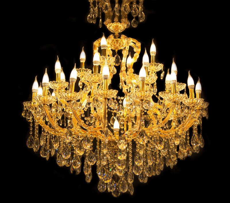 Close up on crystal of contemporary chandelier. Is a branched ornamental light fixture designed to be mounted on ceilings or walls. Black background stock images