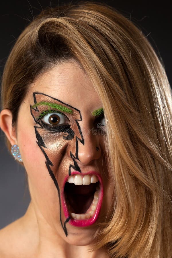 Closeup of Girl Screaming with Lightning Makeup. Closeup of Girl Screaming Lightning Makeup royalty free stock photos